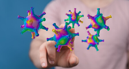 Abstract artwork of a hand interacting with colorful virus elements. Concept of disease, digital art, future h