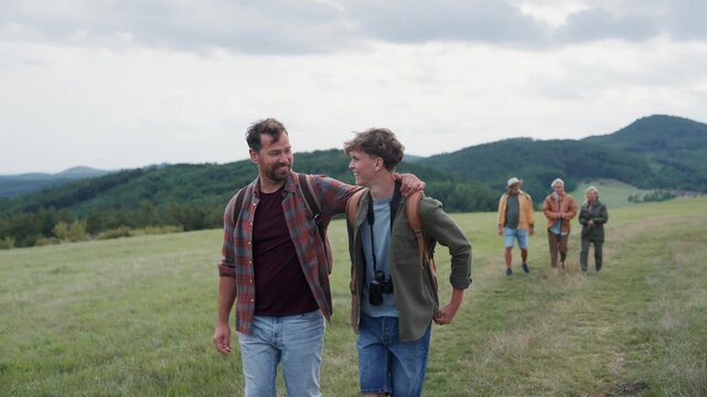 Multigenerational family on hiking trip in nature.