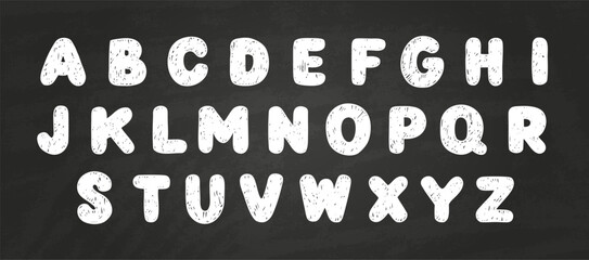 A set of English alphabet letters, handwritten in white chalk on a black isolated background.