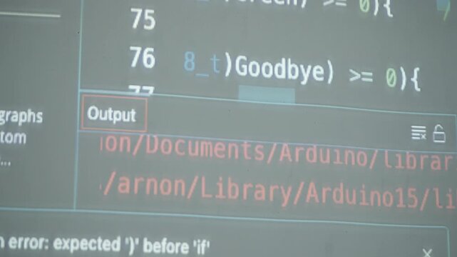 Close-up view of an Arduino IDE screen displaying speech command code for robot control using words like Hello, Red, and Green.