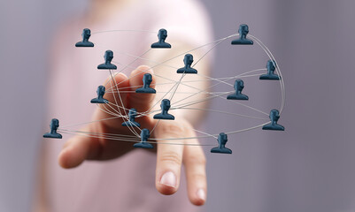 Concept of global digital network with person's hand interacting with interconnected human icons, showcasing technology and social connections.