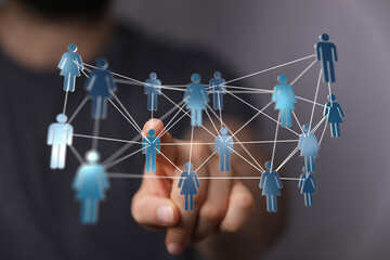 Hand touching digital network of people. Represents concepts of connection, community, and business networking. Great for business, social media