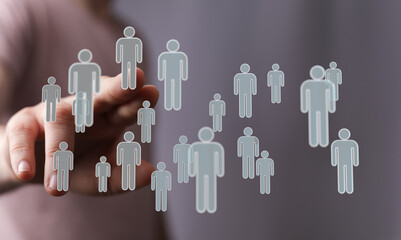 Concept of connection, teamwork and human resources represented by hand touching person icons....