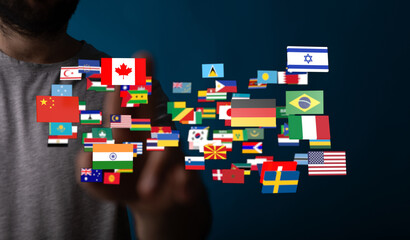 Conceptual image of a person interacting with flags representing global unity, international...