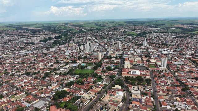 Aerial video footage of a bustling cityscape with modern architecture and urban landscape