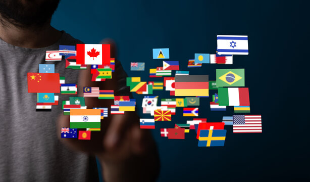 Conceptual image of a person interacting with flags representing global unity, international relations, and world cultures. A visual metaphor fo