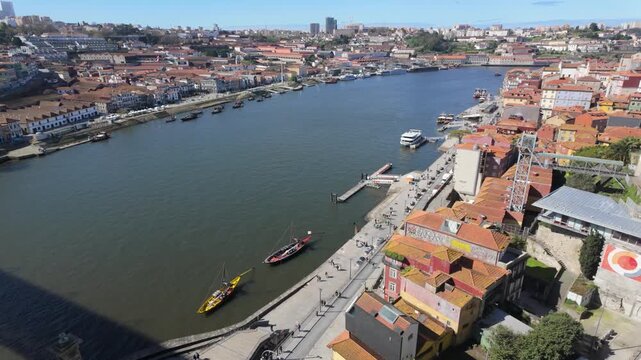Panoramic view of Porto and Douro River from above
Wide cityscape showing Porto skyline and river with boats and urban life.