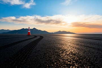 Desert Road with Traffic Cone at Sunset