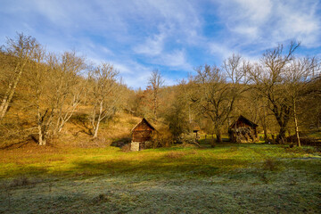 landscape with old wooden houses in the mountains in the Banat area of ​​Romania