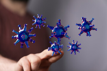 Conceptual 3D rendering of virus particles floating near a human hand, illustrating scientific concepts and me