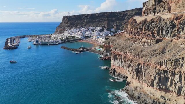 Puerto de Mog&aacute;n Marina and White Village at Sunset, Gran Canaria, Canary Islands - 4K Aerial View