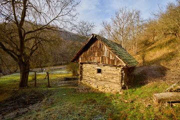 landscape with old wooden houses in the mountains in the Banat area of ​​Romania