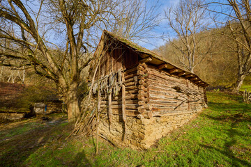 landscape with old wooden houses in the mountains in the Banat area of ​​Romania