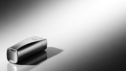 Sleek portable wireless speaker on reflective surface