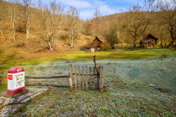 landscape with old wooden houses in the mountains in the Banat area of ​​Romania