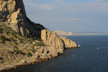 Rest on the Black Sea in Crimea, boating, blue sea, mountains and clear sky, sunny day. Seascape in Ukraine