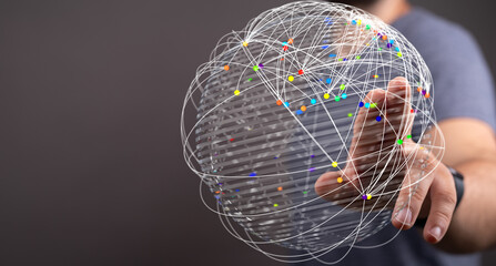 Concept image of a hand interacting with a network sphere, symbolizing global connection and digital communication. Perfect for technology and b