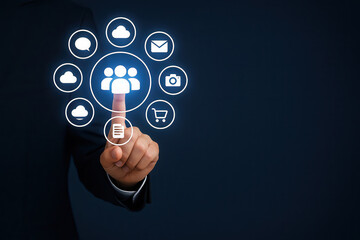 Businessman in suit interacting with digital interface, selecting social media icons, showcasing modern technology and communication concepts in a professional environment with copy space