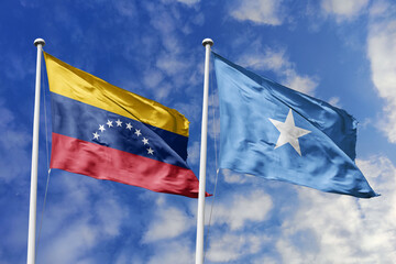 Fototapeta premium Venezuela and Somalia two flags textile cloth, fabric texture, union, peace, conflict and partnership concept. Venezuelan and Somali official national relationship symbols.
