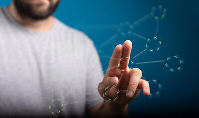 Close up of a man touching a digital network interface, symbolizing connection, technology and innovation.