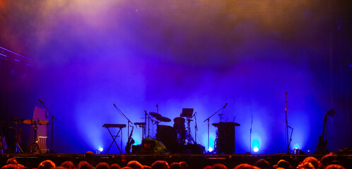 music instruments silhouettes on empty stage, music concert banner background