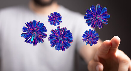 Abstract design with blue digital spheres floating near a hand. Creative representation of technology, data, a