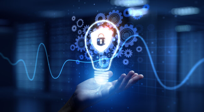 Cyber Security Protecting Digital Systems and Data with Human Hand Holding Lamp Hologram. - Powered by Adobe