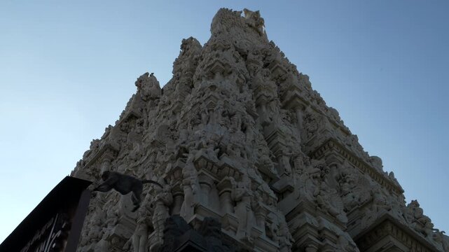 India, Tamil Nadu, 02-07-2025. Low view, Sri Kanchi Kamakshi Amman Temple. monkey jumps from a balustrade. Slow motion 4K