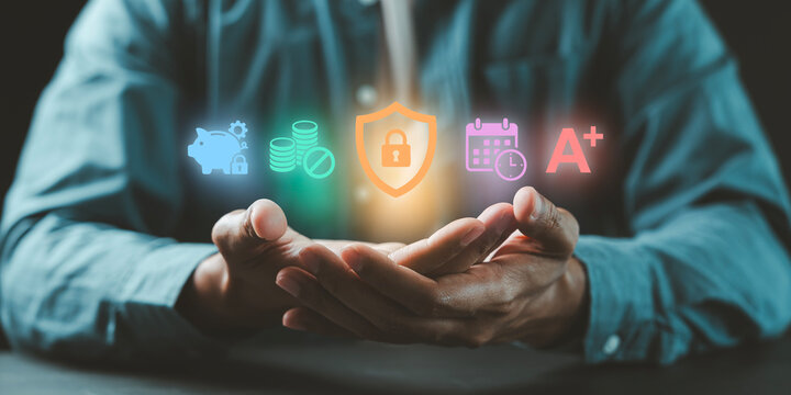 Business man holding digital icons representing cash flow management, financial forecasting, and secure wealth planning for future growth - Powered by Adobe