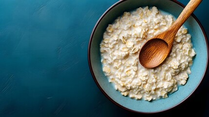 Warm and Wholesome Oatmeal Breakfast in a Wooden Bowl with Spoon