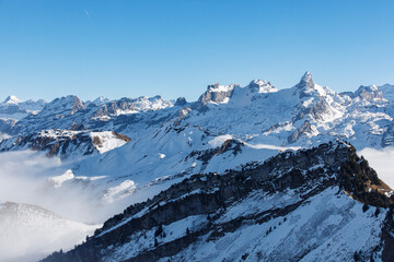 Dramatic aerial view of snow-capped mountains in the Swiss Alps, perfect for travel and adventure th