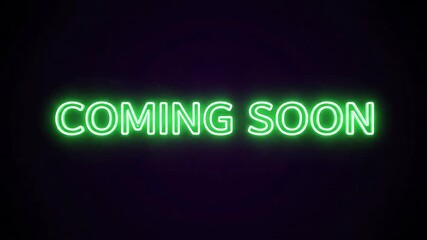 The vibrant green "coming soon" text is glowing brightly with a digitally rendered neon light effect, showcasing retro-futuristic typography against a deep, dark background.
