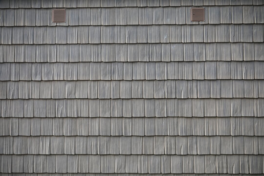 Close-Up of Gray Wooden Shingle Roof with Ventilation Panels