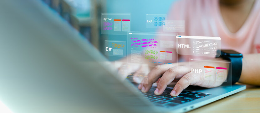 Software Developer working on laptop with virtual coding language screens - Powered by Adobe