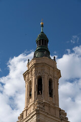 Obraz premium Tower of a cathedral under a blue sky.. Cathedral-Basilica of Our Lady of the Pillar, Zaragoza, Spain