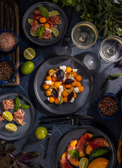 Cantaloupe melon appetizers with prosciutto, basil, and feta cheese