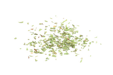 Dried tarragon leaves scattered on a white surface, close-up