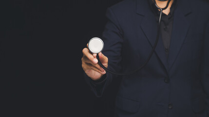 Doctor holding stethoscope for medical checkup concept.
