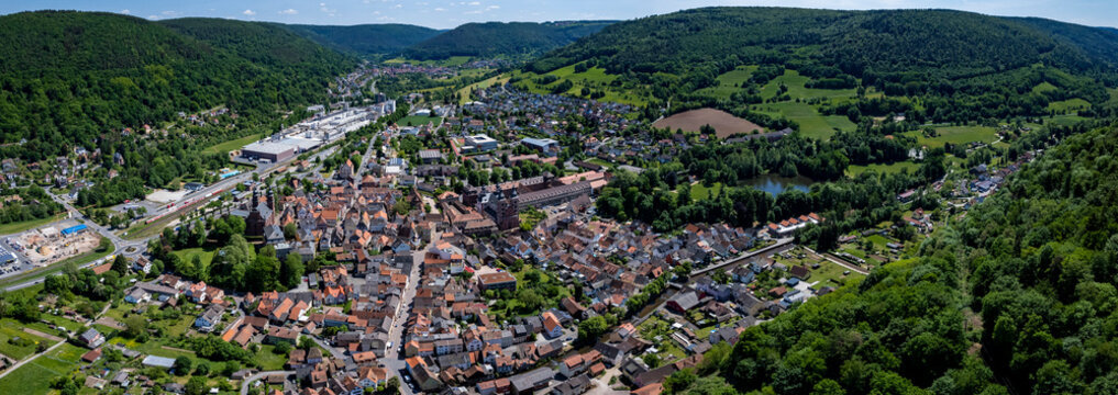 Aerial panoramic view of the city and monastery Amorbach in Germany on a sunny spring noon.