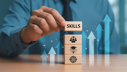 Businessman strategically places a skills development block atop career progression icons symbolizing upward mobility and success