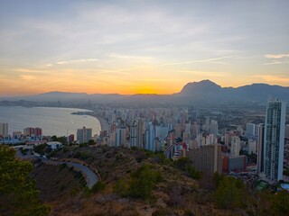 scenic coastal investment view, stunning golden hour scene showcasing residential towers by bay © Vladimir