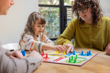 Family playing a board game together