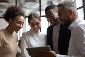 Diverse business team collaborating over a tablet collaboration teamwork 