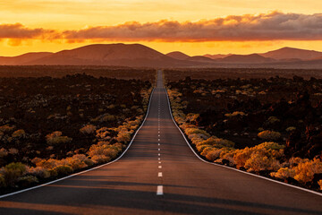 Endless Highway Through Lava Desert at Sunset