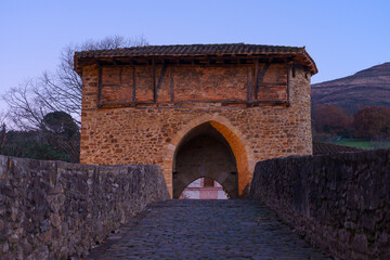 Fototapeta premium Old bridge of Muza in the beautiful village of Balmaseda at night, Vizcaya, Basque country, Spain.