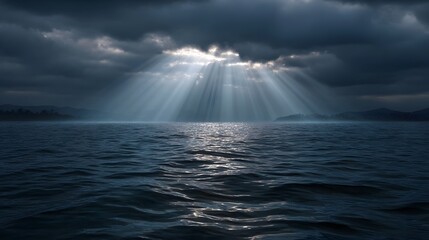 Dramatic sunbeams pierce through dark moody storm clouds casting ethereal light rays onto the vast rippling ocean surface