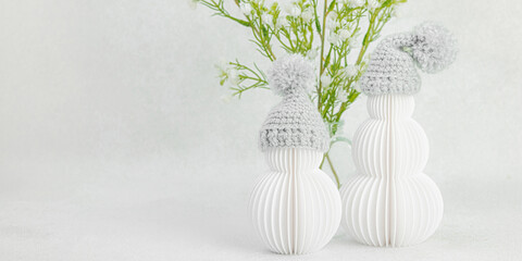 Happy snowmen with spring flowers bouquets. Cute greeting card, Valentine's Day holiday concept