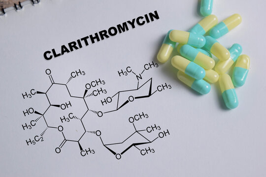 Concept of chemical structure clarithromycin write on book isolated on Wooden Table.