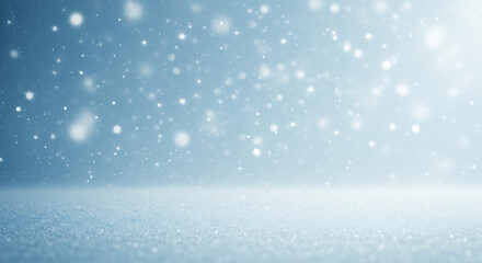Snowfall on serene blue background creating a winter atmosphere  