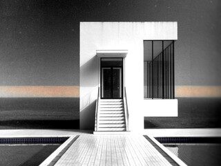 Modern White Building with Stairs and Water Feature